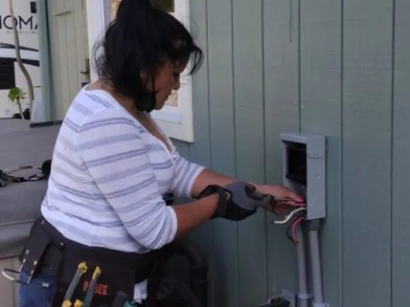 Licensed electrician wiring an exterior subpanel in St. Joseph