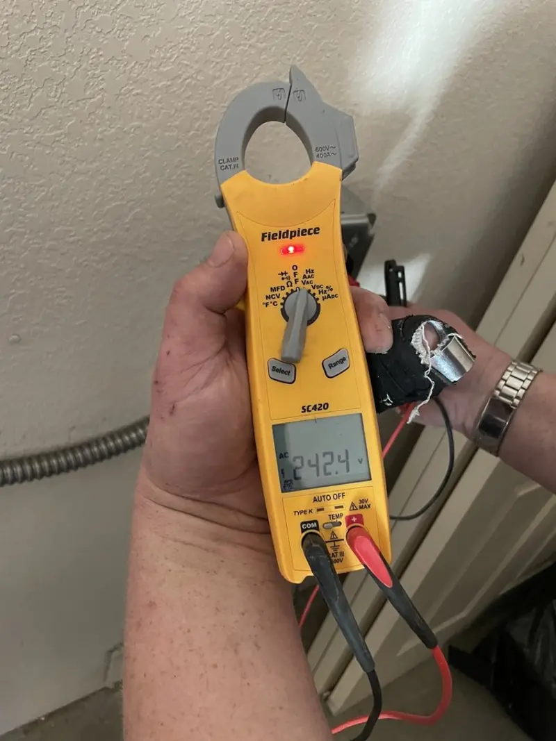 Voltage testing with clamp meter during Outlet Installation in St. Joseph